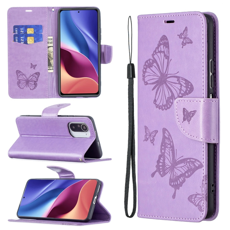 Purple leather phone wallet case with embossed butterflies, card slots, lanyard strap
