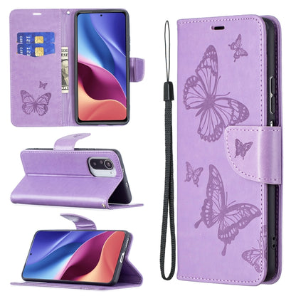 Purple leather phone wallet case with embossed butterflies, card slots, lanyard strap