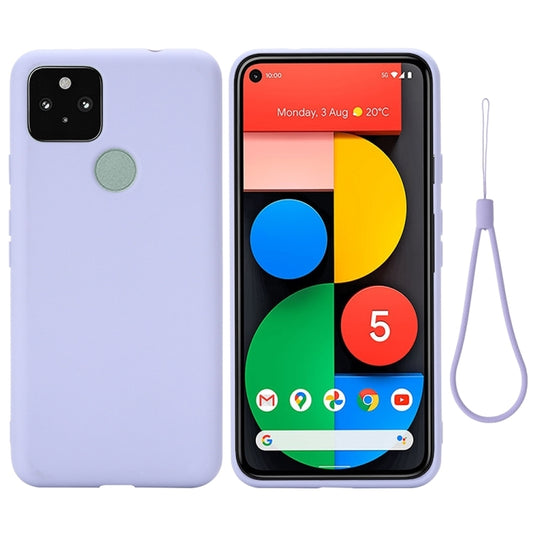 Purple liquid silicone phone case with camera cutouts and raised edges, with green grip pad