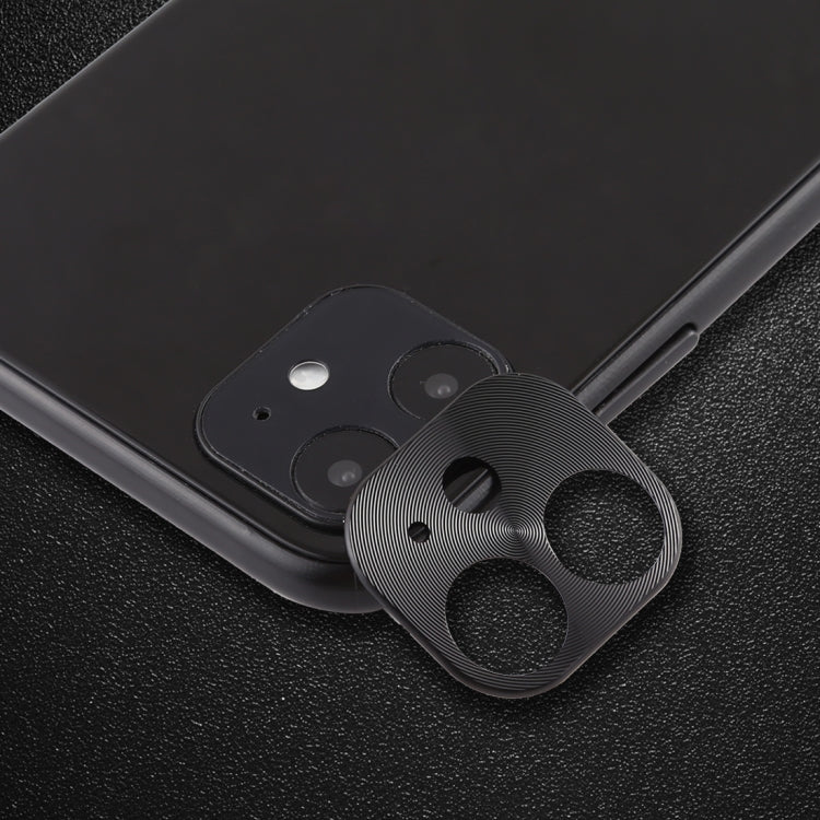 Black rear camera lens protective film on phone back, cardboard-style cutout