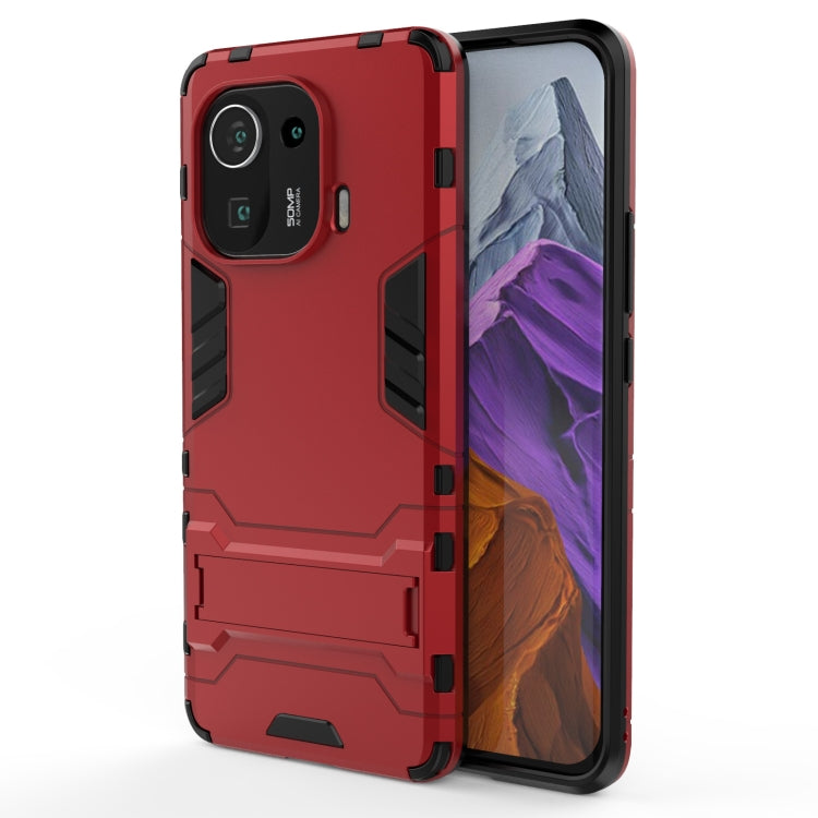 Red rugged shockproof phone case with black shock-absorbing corners and camera cutout