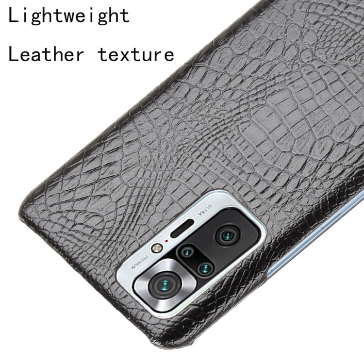 Black crocodile-texture phone case detail with camera cutout and buttons access