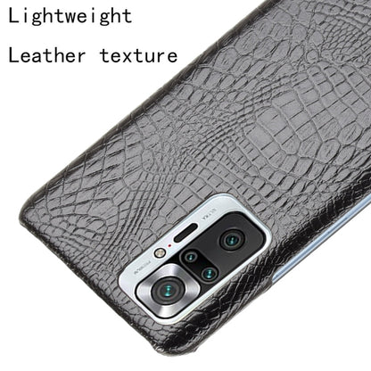 Black crocodile-texture phone case detail with camera cutout and buttons access
