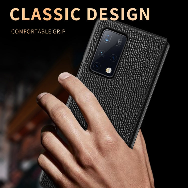 Black textured folding phone case with camera cutout, held in hand for Huawei Mate X2