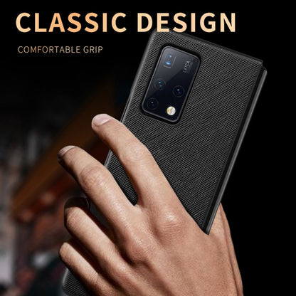 Black textured folding phone case with camera cutout, held in hand for Huawei Mate X2