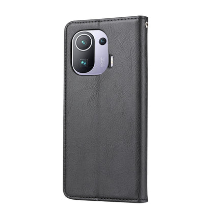 Black leather flip phone case with camera cutout and smooth texture