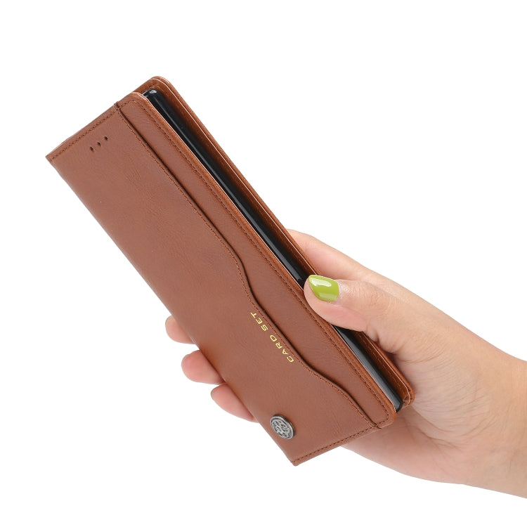 Brown leather flip phone wallet held in hand, slim card-slot design