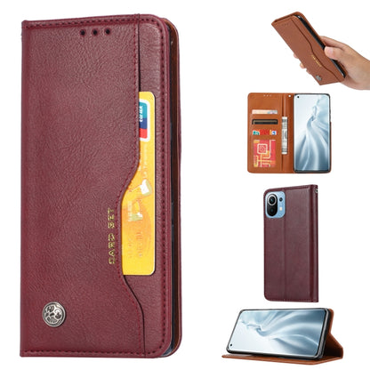 Burgundy leather flip wallet case with card slots and fold-out photo frame stand