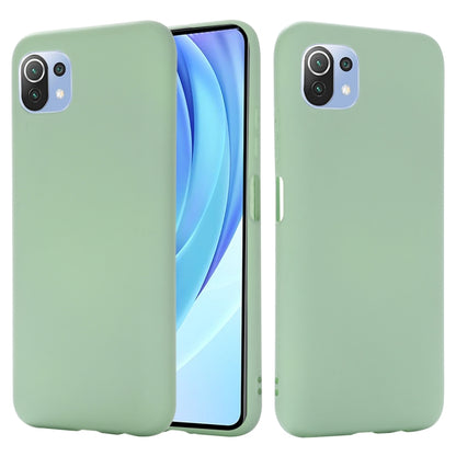 Green liquid silicone protective phone case with cutouts and raised camera edges.