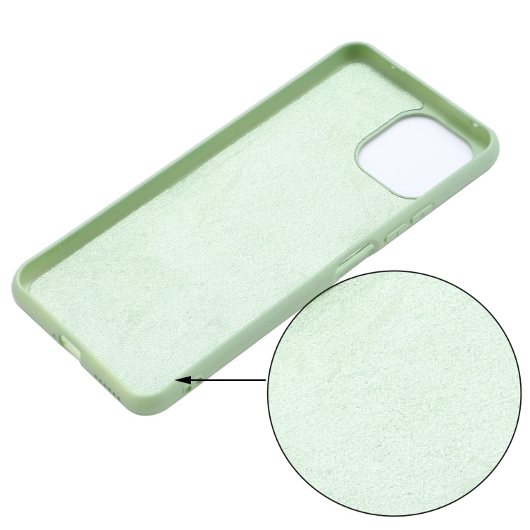 Green liquid silicone phone case texture close-up with precise camera and button openings.