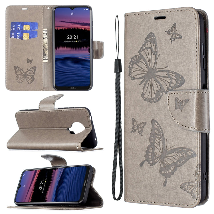 Grey PU leather flip phone case with embossed butterflies, card slot, and wrist lanyard