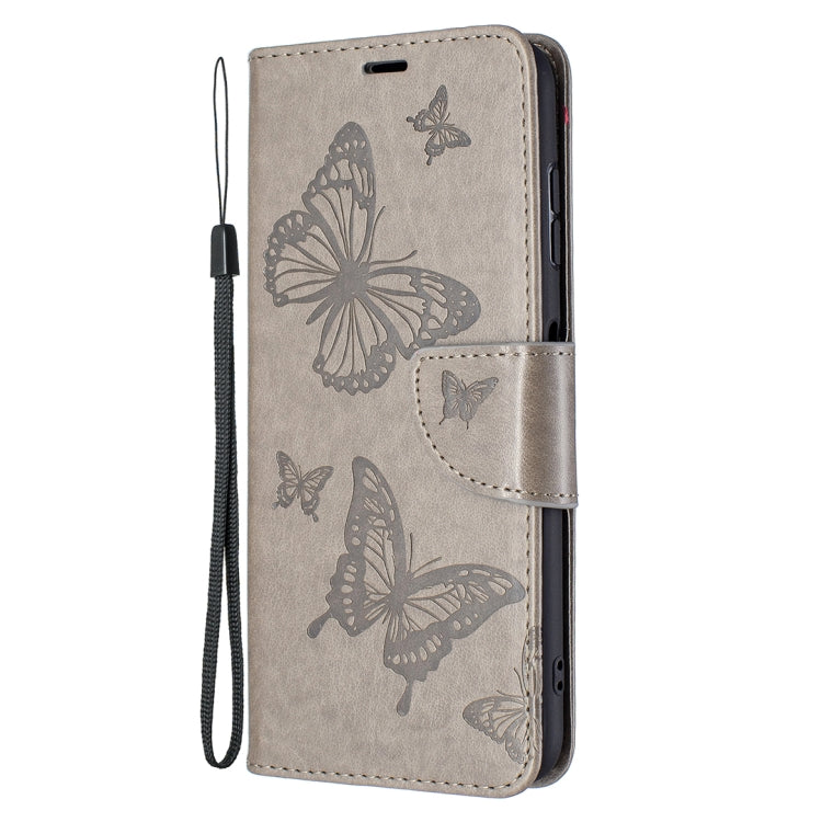 Grey PU leather flip phone case with embossed butterflies and detachable wrist lanyard