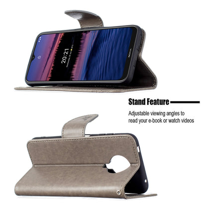Grey PU leather flip phone case with embossed butterflies, stand, and flip cover