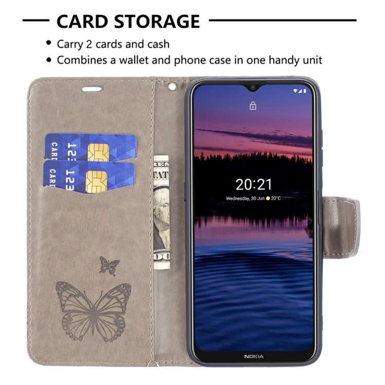 Grey PU leather flip phone case with butterfly embossing, card storage, and lanyard
