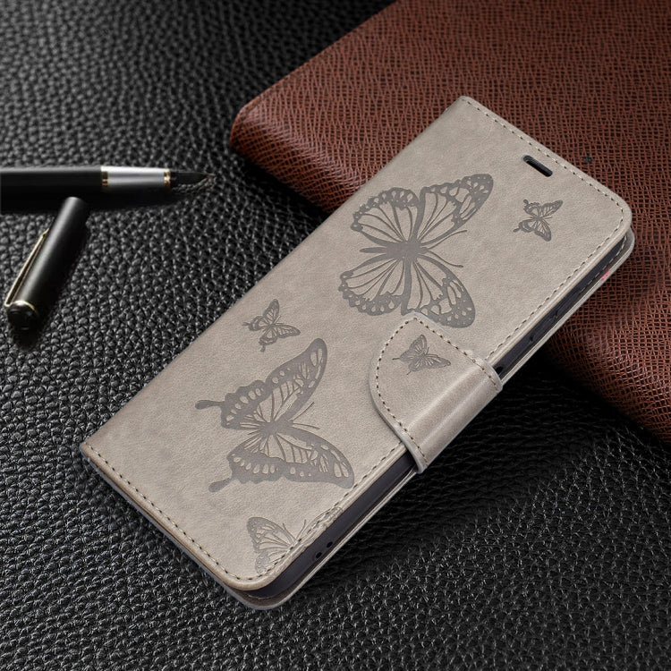 Grey PU leather flip phone case with embossed butterflies and stitched side flap