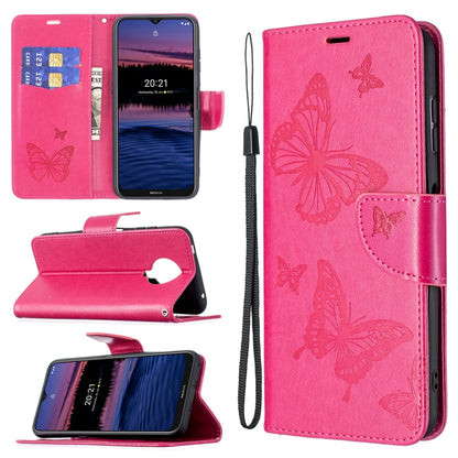 Hot pink PU leather phone wallet case with embossed butterfly pattern, card slot, and wrist lanyard
