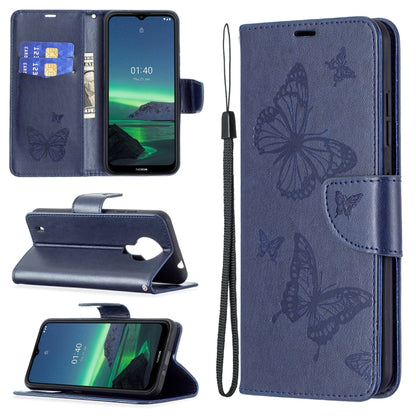 Dark blue PU leather flip phone case with embossed butterflies, card slot, and wrist lanyard