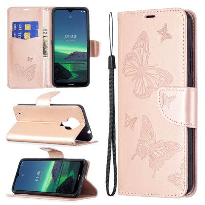 Beige PU leather phone wallet case with embossed butterfly pattern, card slot, and wrist lanyard