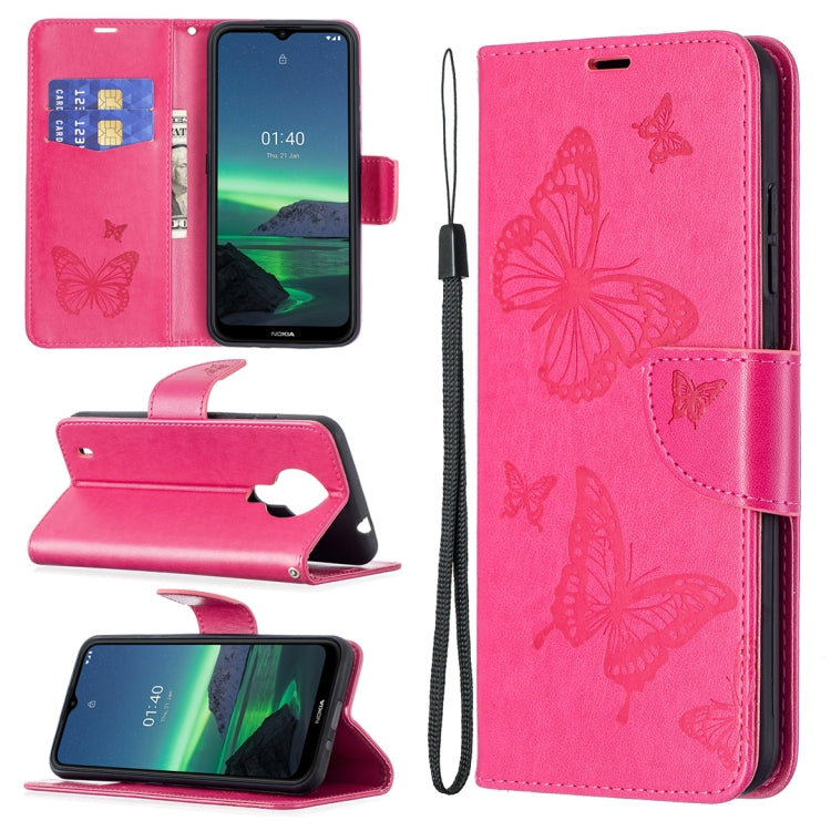 Bright pink PU leather phone wallet case with embossed butterfly pattern and wrist lanyard