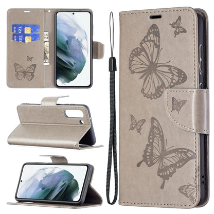 Light gray PU leather phone wallet case with embossed butterflies, card slot, and wrist lanyard