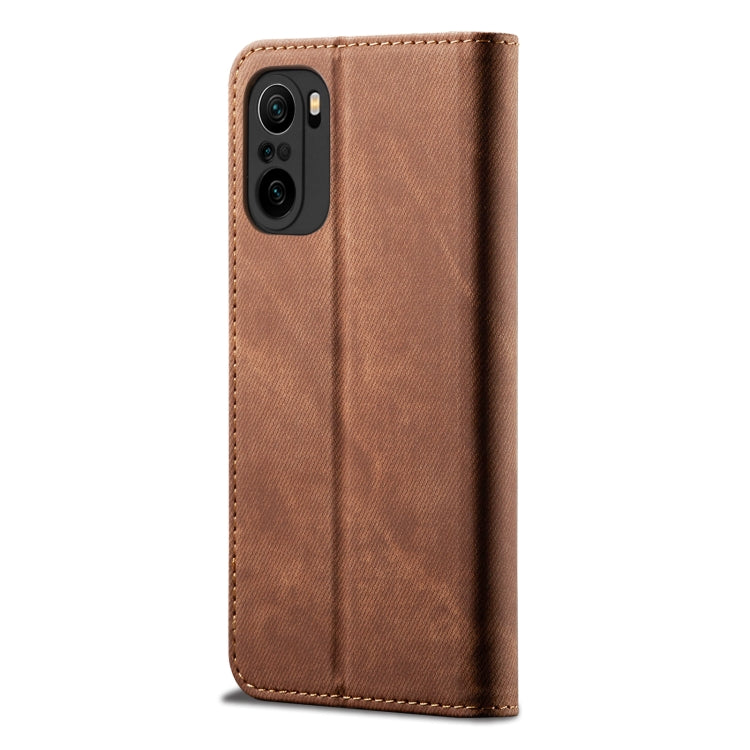 Brown denim phone wallet case with camera cutout and magnetic snap