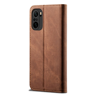 Brown denim phone wallet case with camera cutout and magnetic snap