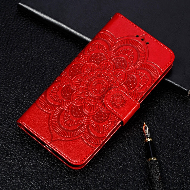 Red embossed mandala wallet phone case with card slots and lanyard strap.