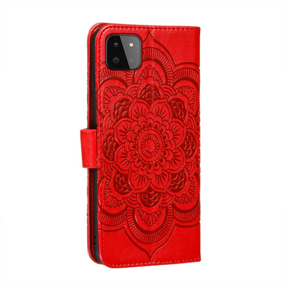 Red embossed mandala flip wallet case with window cutout for camera and flash.