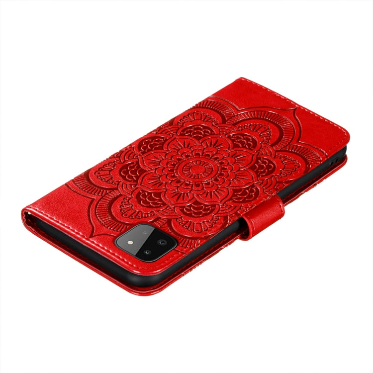 Red embossed mandala flip phone case with magnetic clasp and cutout for camera.
