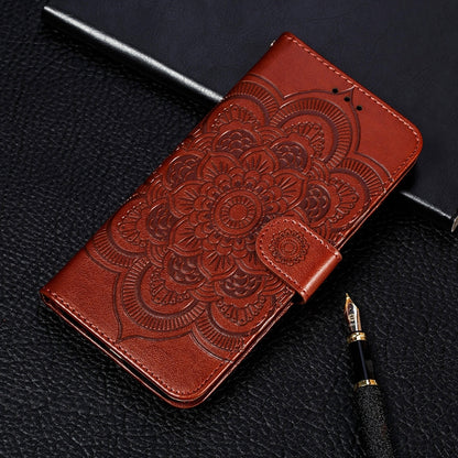 Brown embossed mandala wallet phone case with card slots and lanyard strap.