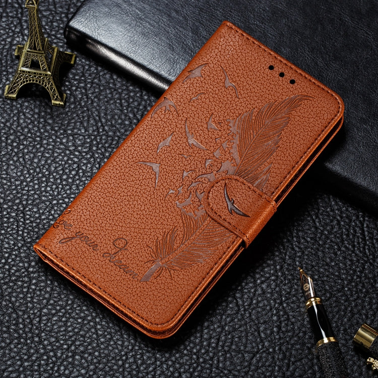 Orange-brown litchi-textured folio phone case with embossed feather-leaf pattern and flip