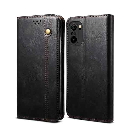 Black leather flip phone wallet case with card slots and camera cutout, visible side view.