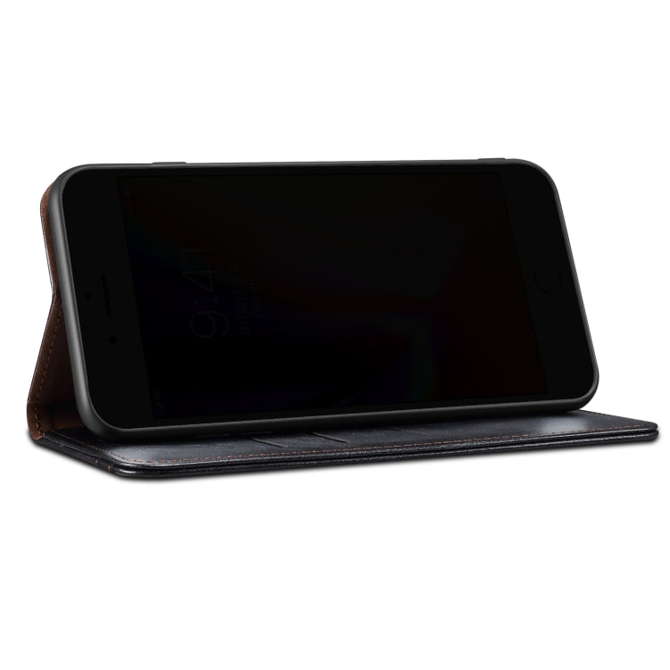 Black leather flip phone wallet case with cover open and phone held in place.