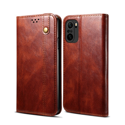 Brown leather flip phone wallet case with card slots and camera cutout, front and back views.