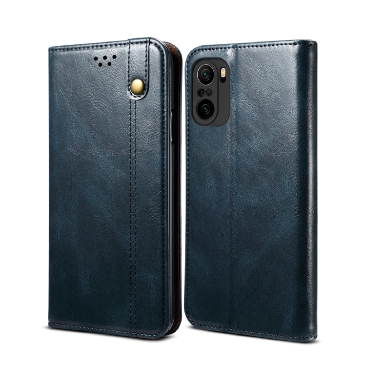Navy leather flip phone wallet case with card slots and camera cutout, paired front/back.