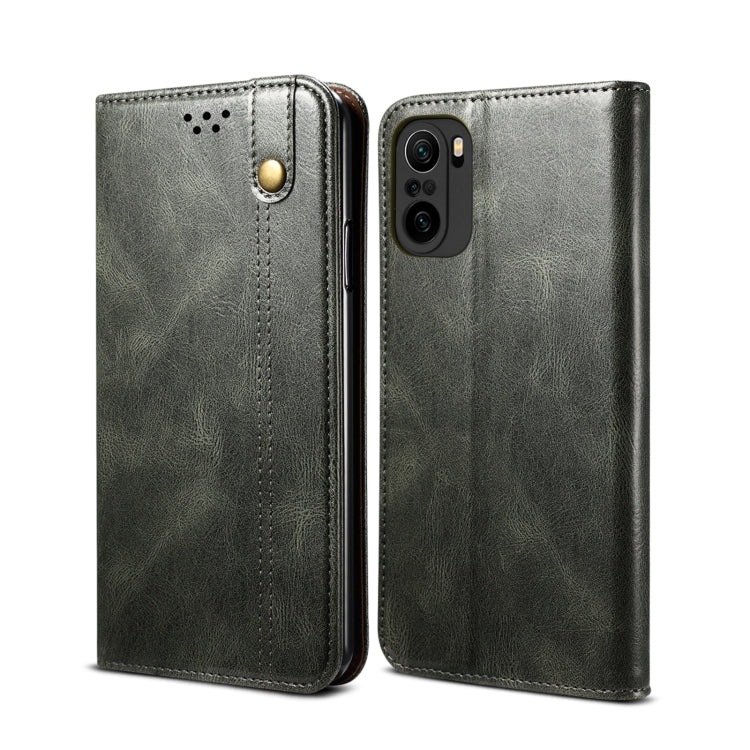 Dark green leather flip phone wallet case with card slots and camera cutout, front/back views.