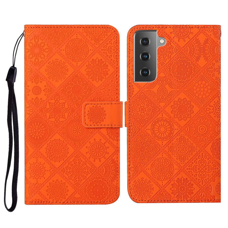 Orange embossed flip leather phone case with lanyard, card slot and wallet flap