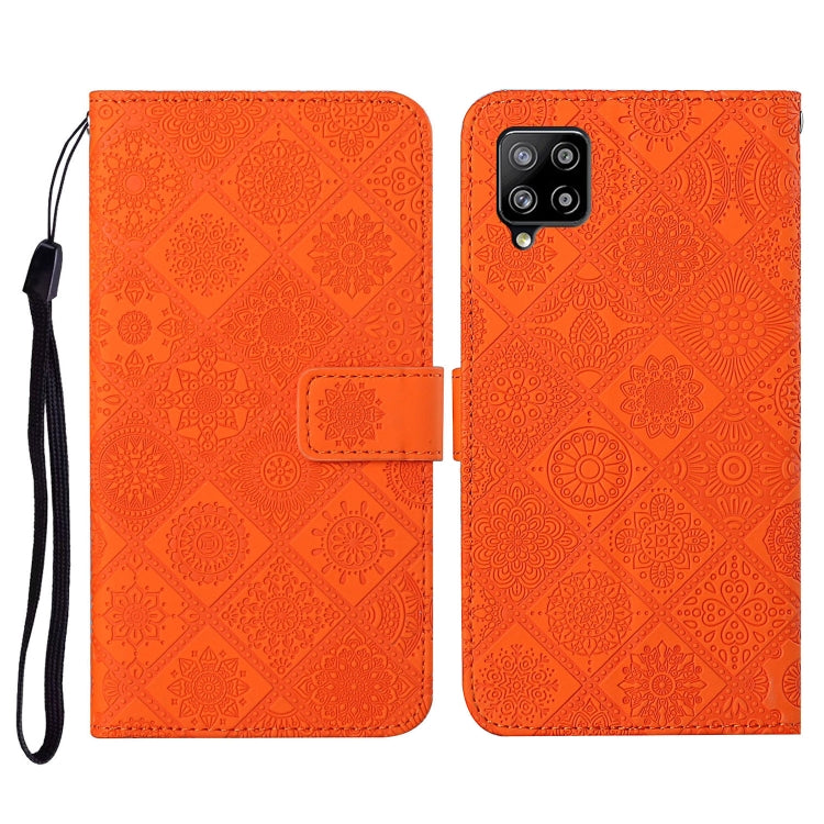 Orange embossed folio wallet case with card slot and wrist strap for phone