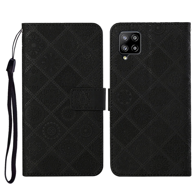 Embossed leather flip phone case with card slots, lanyard strap; black pattern, phone cutout
