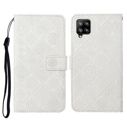 Embossed leather flip phone case with card slots, lanyard strap; white textured pattern, phone cutout