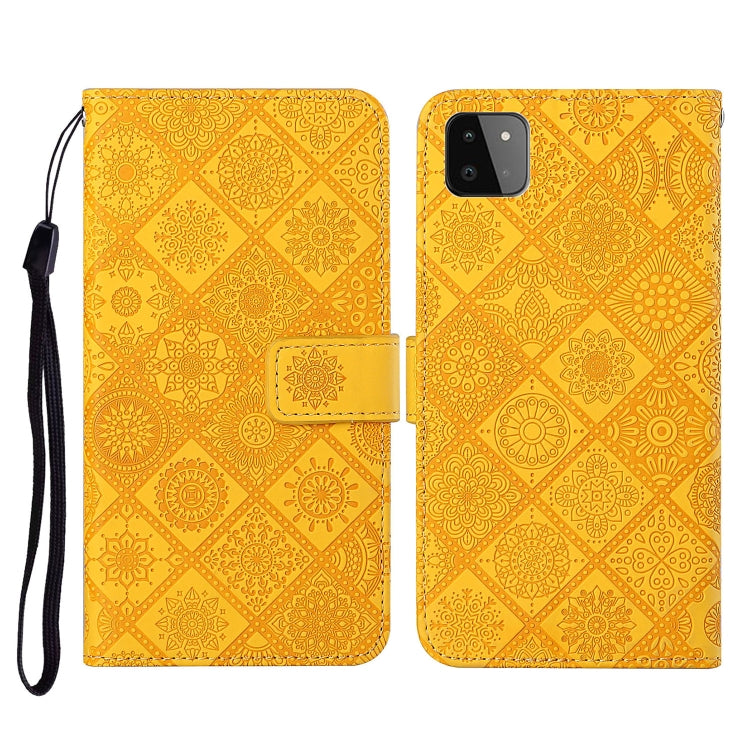 Embossed leather flip phone case with card slots, lanyard strap; yellow/gold pattern, phone cutout