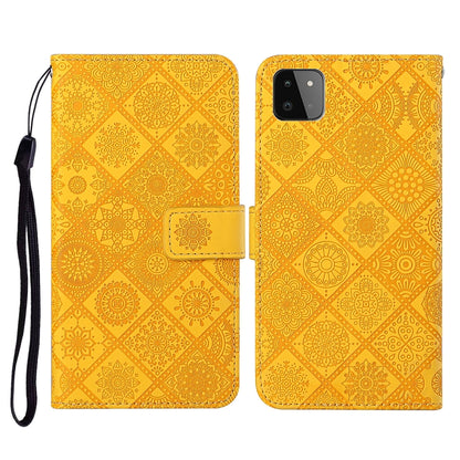 Embossed leather flip phone case with card slots, lanyard strap; yellow/gold pattern, phone cutout