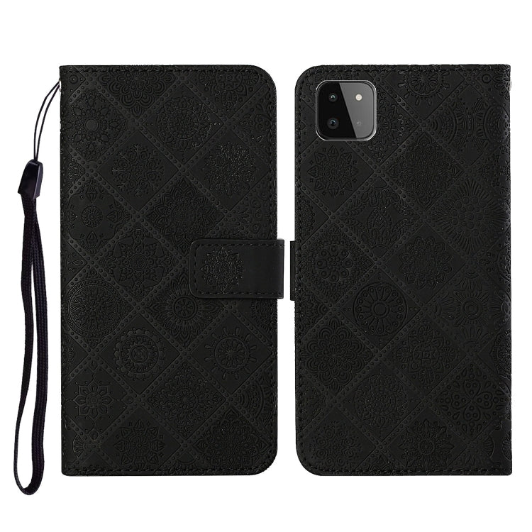 Embossed leather flip phone case with card slots, lanyard strap; dark black pattern, phone cutout