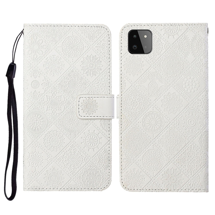 Embossed leather flip phone case with card slots, lanyard strap; off-white textured pattern, phone cutout
