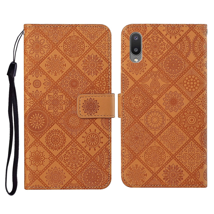 Brown embossed flip leather phone case with card slots, wallet, and lanyard strap