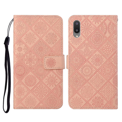 Pink embossed flip leather phone case with card slots, wallet, and lanyard strap