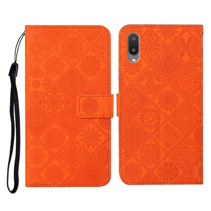 Orange embossed flip leather phone case with card slots, wallet, and lanyard strap