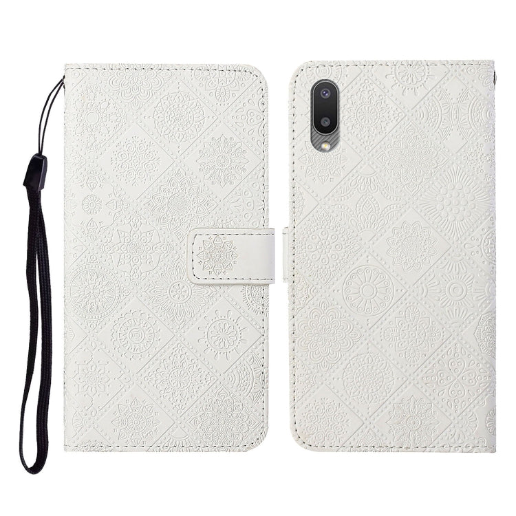 White embossed flip leather phone case with card slots, wallet, and lanyard strap