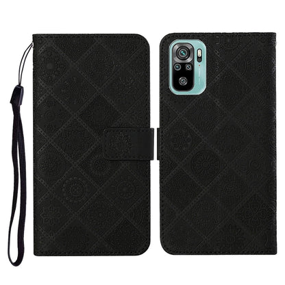 Black embossed flip leather phone wallet case with card slots and wrist lanyard.