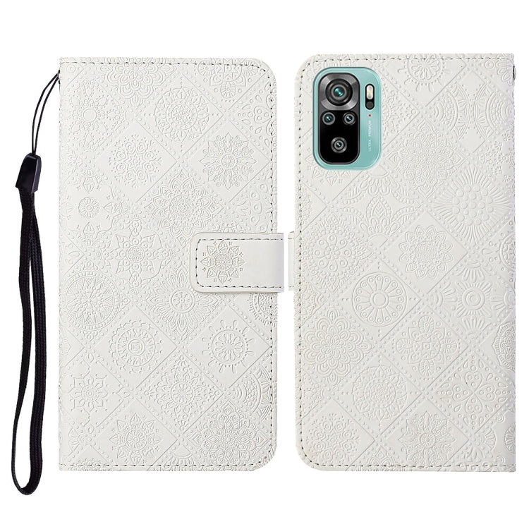 White embossed flip leather phone wallet case with card slots and wrist lanyard.